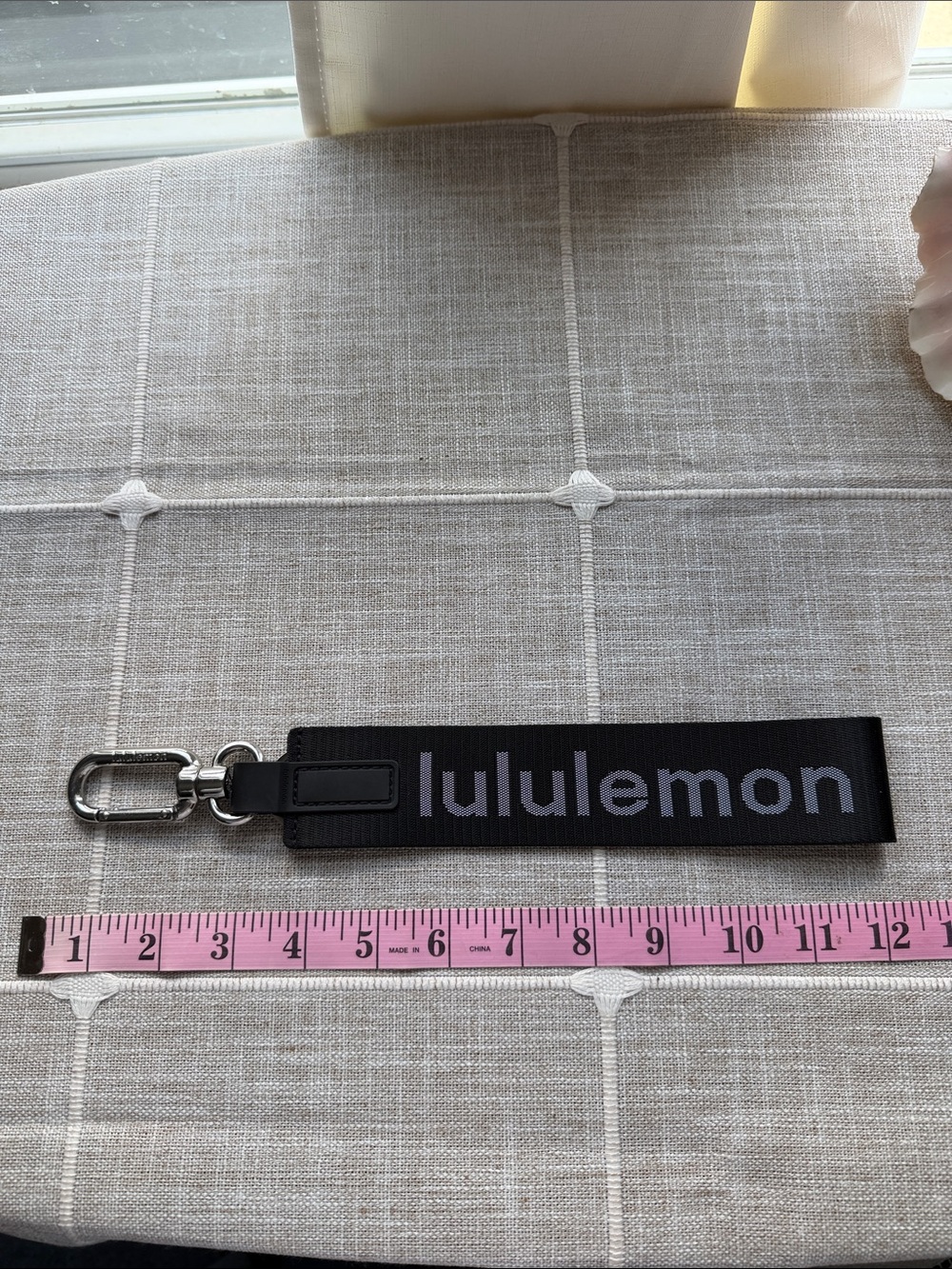 lululemon black and silver key fob wristlet